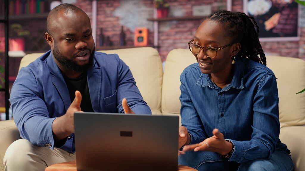 How Digital Tools Can Simplify Your Business Operations: A Practical Guide for Nigerian SMEs african american young freelancers couch sharing business idea 1 1024x576