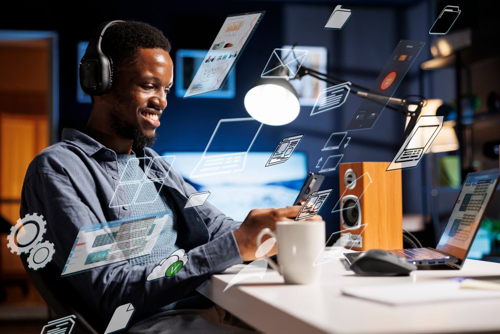 How Digital Tools Can Simplify Your Business Operations: A Practical Guide for Nigerian SMEs business person using laptop multitasking finish daily startup tasks